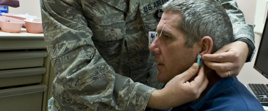 Lt. Col. (Dr.) Paul Crawford, 99th Medical Operations Squadron associate program director for Nellis Family Medicine Residency, attaches an Alpha Simulator to U.S Army Staff Sgt. Paul Kelly, motor transport operator from the Community Base Warrior Transition Unit in Fort Lewis, Wash., during his acupuncture appointment April 17, 2013, at the Mike O’Callaghan Federal Medical Center, at Nellis Air Force Base, Nev. An Alpha Stimulator is used for electro-acupuncture. Electro-acupuncture is a form of acupuncture where a small electric current is passed between pairs of acupuncture needles. This practice augments the use of regular acupuncture, can restore health and well-being, and is particularly good for treating pain. (U.S. Air Force photo by Senior Airman Matthew Lancaster)